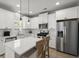 Updated kitchen boasting white cabinets, stainless steel appliances, and sleek countertops at 110 Levis Song Ct, Goose Creek, SC 29445