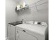 This laundry room features a side by side washer and dryer and wire shelving at 110 Levis Song Ct, Goose Creek, SC 29445