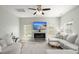 Bright living room featuring a decorative fireplace, ceiling fan, and a comfortable sectional sofa at 110 Levis Song Ct, Goose Creek, SC 29445