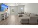Comfortable living room with large sectional sofa, and ample light from the windows at 110 Levis Song Ct, Goose Creek, SC 29445