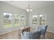 Bright living room featuring multiple windows and light wood floors at 110 Levis Song Ct, Goose Creek, SC 29445
