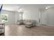 Spacious living room with neutral sectional sofa, ceiling fan, and ample lighting at 110 Levis Song Ct, Goose Creek, SC 29445