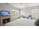 Inviting main bedroom featuring a decorative fireplace and large windows at 110 Levis Song Ct, Goose Creek, SC 29445