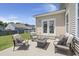 This patio has chairs, a sofa, and fire pit for relaxing outdoors at 110 Levis Song Ct, Goose Creek, SC 29445