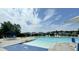 View of the community pool with lounge chairs, an umbrella, and neighborhood homes in the background at 110 Levis Song Ct, Goose Creek, SC 29445