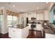 Well-equipped kitchen with stainless steel appliances, an island, and sleek countertops at 113 Crosscut Ln, Summerville, SC 29486