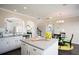 Bright kitchen with stainless steel appliances and a kitchen island that flows into the dining room at 113 Crosscut Ln, Summerville, SC 29486