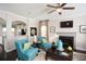 Cozy living room with hardwood floors, comfortable seating, and a fireplace at 113 Crosscut Ln, Summerville, SC 29486