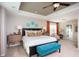 Spacious main bedroom with a tray ceiling, a king-sized bed, and an en-suite bathroom at 113 Crosscut Ln, Summerville, SC 29486
