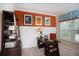 Well-lit home office with a desk, shelving, and a colorful accent wall at 113 Crosscut Ln, Summerville, SC 29486