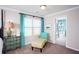 Stylishly decorated bedroom featuring a turquoise accent wall and connecting bathroom at 113 Crosscut Ln, Summerville, SC 29486