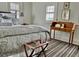 Bedroom with gray patterned bedding and a striped rug at 12 Orange St, Charleston, SC 29401