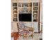 Charming built-in shelving displays curated decor, providing a cozy reading nook at 12 Orange St, Charleston, SC 29401