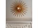 Decorative wall decor with gold star motif above a fireplace in updated home at 12 Orange St, Charleston, SC 29401
