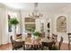 Dining area featuring chandelier, dining table, and herringbone wood floors at 12 Orange St, Charleston, SC 29401