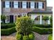 Beautiful brick exterior with manicured hedges and trees at 12 Orange St, Charleston, SC 29401