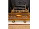 Elaborate gold fireplace screen and fender add vintage charm at 12 Orange St, Charleston, SC 29401