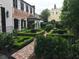 Beautiful brick garden design with manicured shrubs at 12 Orange St, Charleston, SC 29401