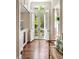 Bright hallway with hardwood floors and access to outdoor patio at 12 Orange St, Charleston, SC 29401