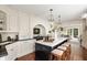 Stunning open kitchen with marble island, custom cabinets, and adjacent living space at 12 Orange St, Charleston, SC 29401