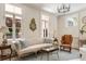 Bright living room with chandelier, white sofa and hardwood floors at 12 Orange St, Charleston, SC 29401