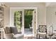 Elegant living room with French doors that lead to a gorgeous outdoor patio at 12 Orange St, Charleston, SC 29401