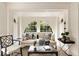 Inviting living room featuring large arched windows and sophisticated decor at 12 Orange St, Charleston, SC 29401