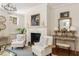 Bright and airy living room featuring a fireplace, stylish decor, and ample natural light at 12 Orange St, Charleston, SC 29401