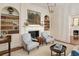 Sitting room featuring fireplace, built-in bookcases, and neutral tones at 12 Orange St, Charleston, SC 29401