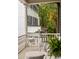 Cozy porch seating area with decorative cushions and charming outdoor setting at 12 Orange St, Charleston, SC 29401