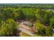 An aerial shot showcasing a home nestled within a community surrounded by lush forests at 120 Perry Hill Rd, Moncks Corner, SC 29461