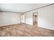 Spacious bedroom with neutral walls features wood-look floors and access to the bathroom at 120 Perry Hill Rd, Moncks Corner, SC 29461