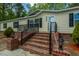 Charming single-story home with brick steps and a well-manicured yard at 120 Perry Hill Rd, Moncks Corner, SC 29461