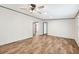 An empty living room featuring wood flooring, ceiling fan, and neutral wall paint at 120 Perry Hill Rd, Moncks Corner, SC 29461