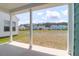Scenic back porch view of a community pond, landscaping, and beautiful homes at 1238 Homecoming Blvd Blvd, Ravenel, SC 29470