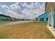 Large backyard with lake views, showcasing blue siding and ample space for outdoor activities at 1238 Homecoming Blvd Blvd, Ravenel, SC 29470