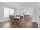Elegant dining room featuring hardwood floors, and ample natural light that flows to the kitchen at 1238 Homecoming Blvd Blvd, Ravenel, SC 29470