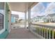 Inviting front porch with views of the neighborhood and space for seating at 1238 Homecoming Blvd Blvd, Ravenel, SC 29470