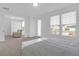 Comfortable main bedroom with a recliner sofa, and large windows that provide ample natural light at 1238 Homecoming Blvd Blvd, Ravenel, SC 29470