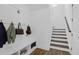 Bright mud room featuring a bench, coat hooks, and staircase with wood treads at 1238 Homecoming Blvd Blvd, Ravenel, SC 29470