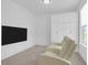 Cozy sitting room boasts comfortable seating, built-in storage, and a mounted television at 1238 Homecoming Blvd Blvd, Ravenel, SC 29470