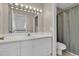 Bathroom featuring white vanity, mirror with lights, and shower at 1325 Moss Path, Mount Pleasant, SC 29464
