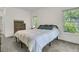Bedroom with plush carpet, king bed, and generous natural light from the surrounding windows at 1325 Moss Path, Mount Pleasant, SC 29464