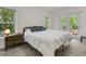 Cozy bedroom with plush carpet, king bed, and a private deck with a waterfront view at 1325 Moss Path, Mount Pleasant, SC 29464