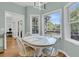 Charming breakfast nook bathed in natural light, featuring a round table and views of the backyard at 1325 Moss Path, Mount Pleasant, SC 29464