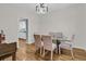 Formal dining room with modern lighting, hardwood floors, and comfortable seating for elegant dining at 1325 Moss Path, Mount Pleasant, SC 29464