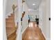 Home foyer with natural hardwood floors and view of the staircase and living room at 1325 Moss Path, Mount Pleasant, SC 29464