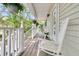 Inviting front porch with white rocking chairs and hanging flower baskets, adding to the home's charm at 1325 Moss Path, Mount Pleasant, SC 29464