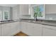 Kitchen with an oven cooktop, sink with faucet and view of the backyard at 1325 Moss Path, Mount Pleasant, SC 29464