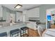 Cozy kitchen featuring white cabinets, a breakfast bar, and modern appliances for a delightful cooking experience at 1325 Moss Path, Mount Pleasant, SC 29464